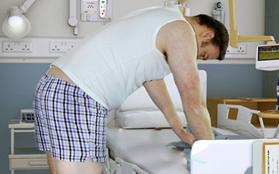 David standing at hospital bed