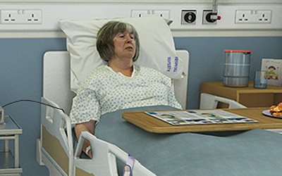 Diane in hospital bed.