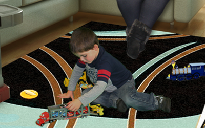 Hayden Smith playing with toys in living room